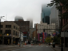 The fog slowly lifts over downtown Minneapolis on Saturday morning.